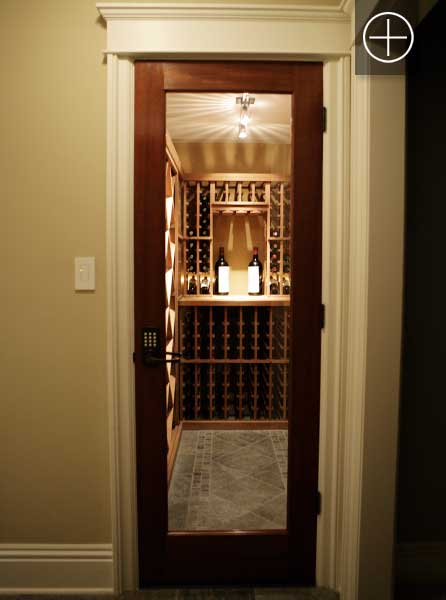 A Vigilant custom mahogany full glass square fully insulated smalle wine room entrance door.