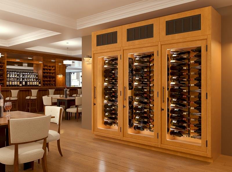 Vigilant triple wine cabinet in Harvest stain with a top mounted cooling system, entry doors and metal wine racks