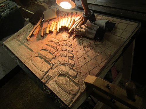 Hand carved panel for Vigilant's solid wood wine cellar door